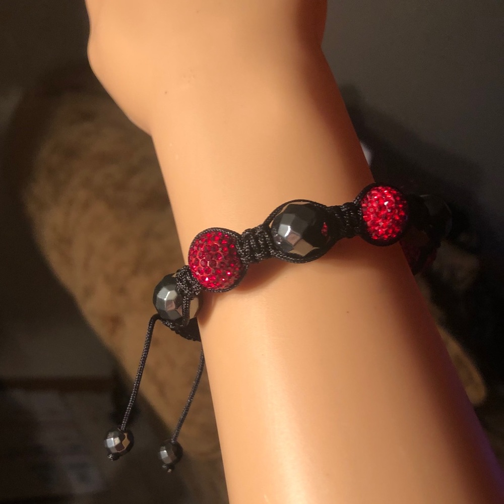 L50:  gorgeous 12 mm hematite and red crystal bead bracelet - adjustable